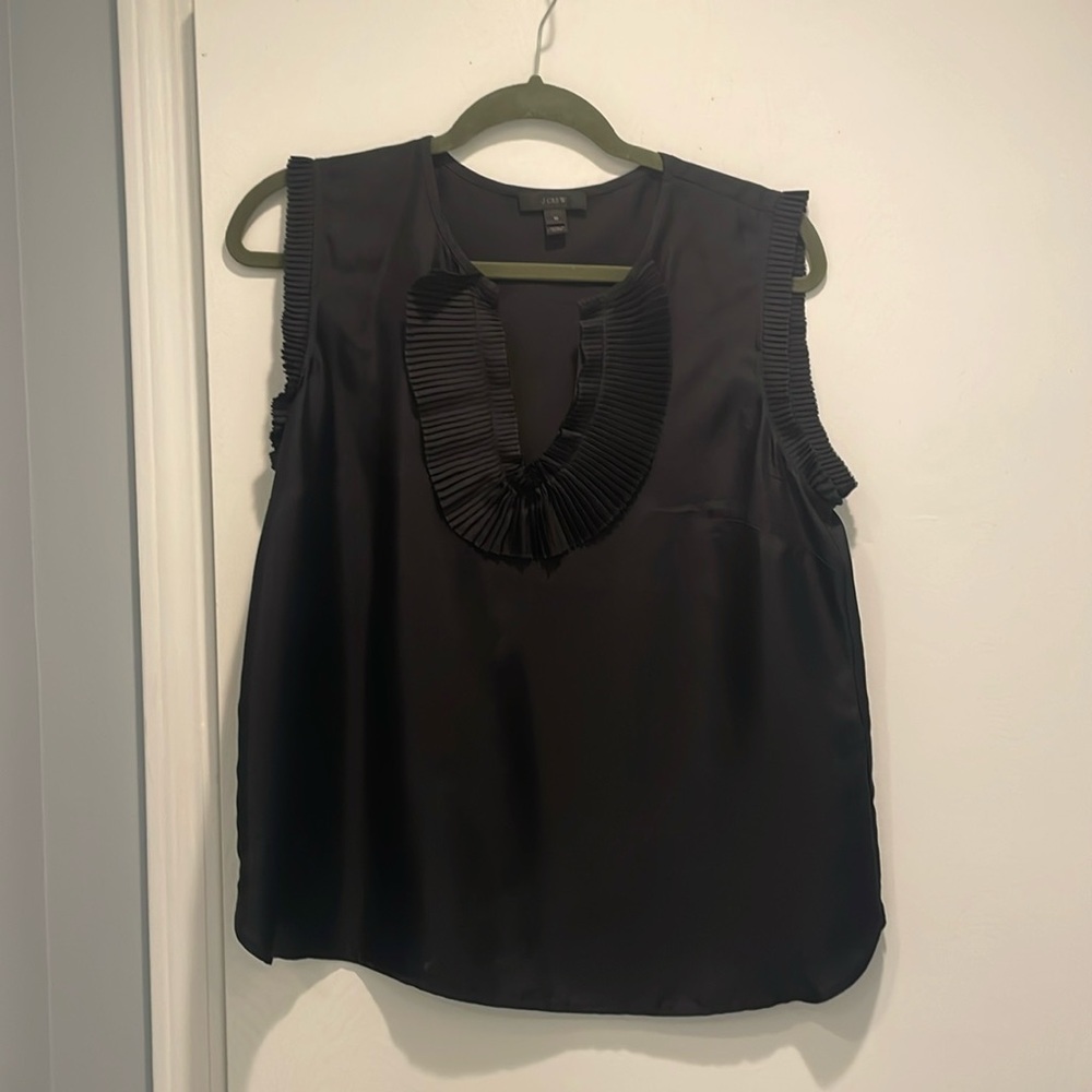Black 100% silk J. Crew top with accordion neck and arm detail.